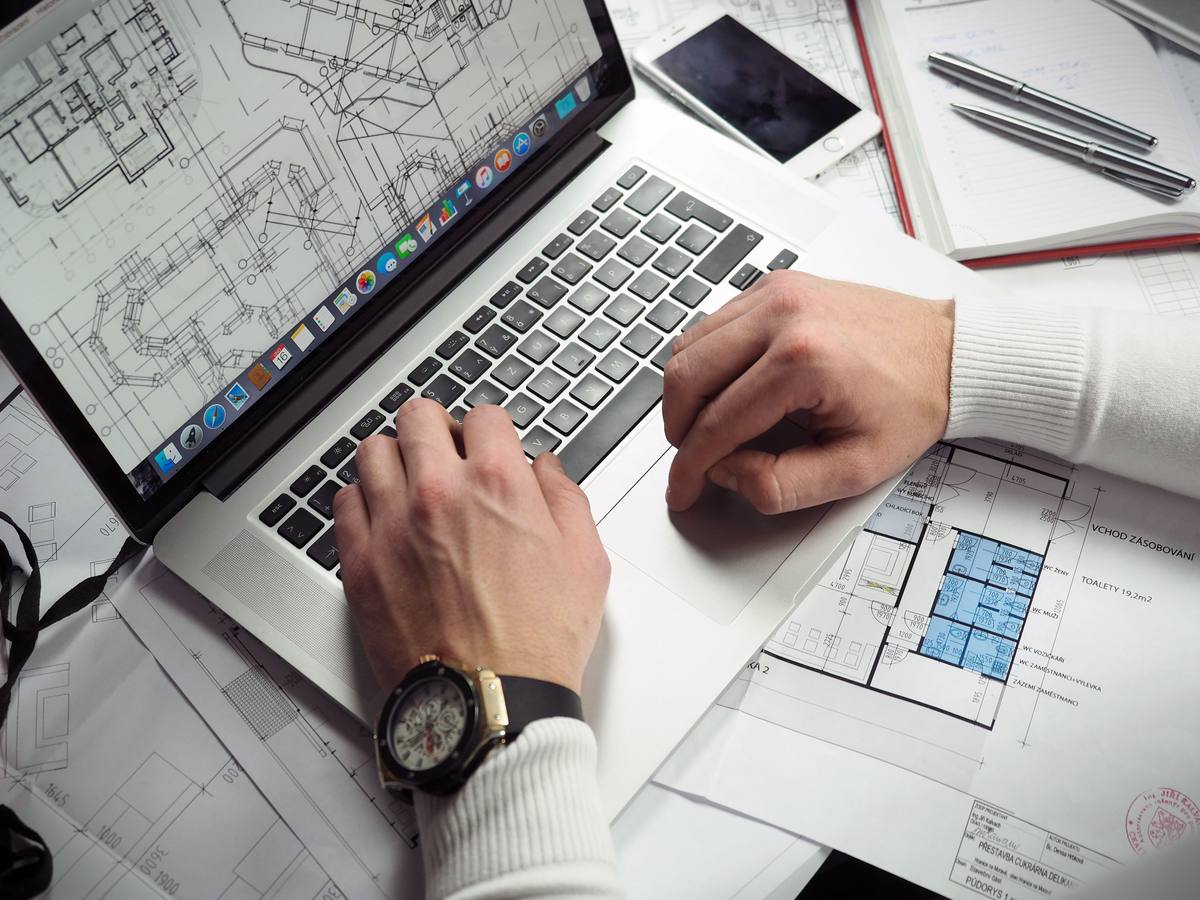 Estimator reviewing a planset at their desk